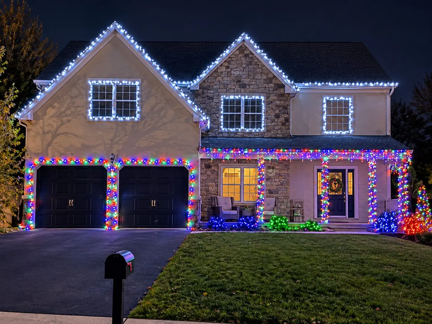 SZNS holiday lighting installation with icicle lights and roofline color in Forks Township, PA.